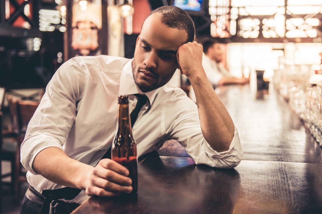 sad man sitting at the bar