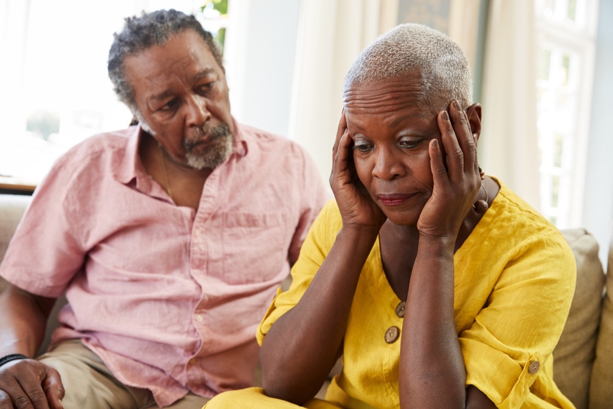 man comforting older woman with depression, contagious conditions