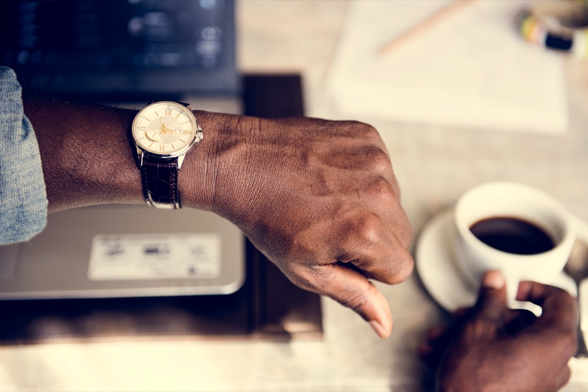 man checking watch when someone is late