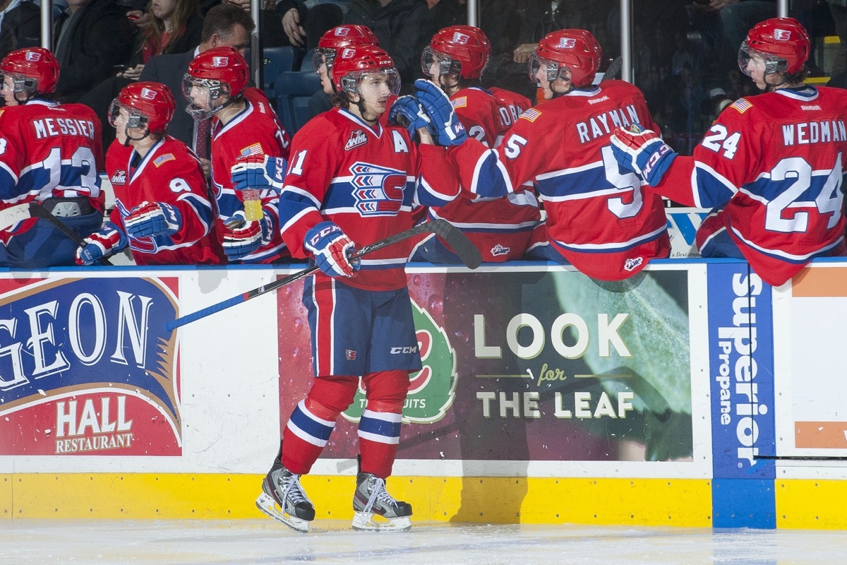 Liam Stewart in hockey uniform on the ice