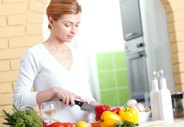 Lady cutting vegetables