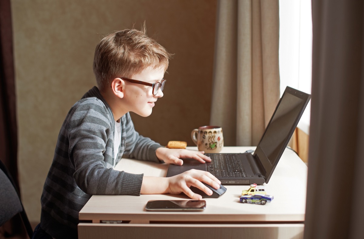 Boy doing work at desk