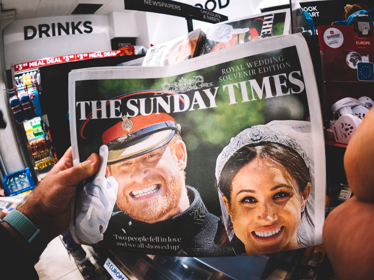 royal couple meghan and harry on front page of british newspaper, meghan markle