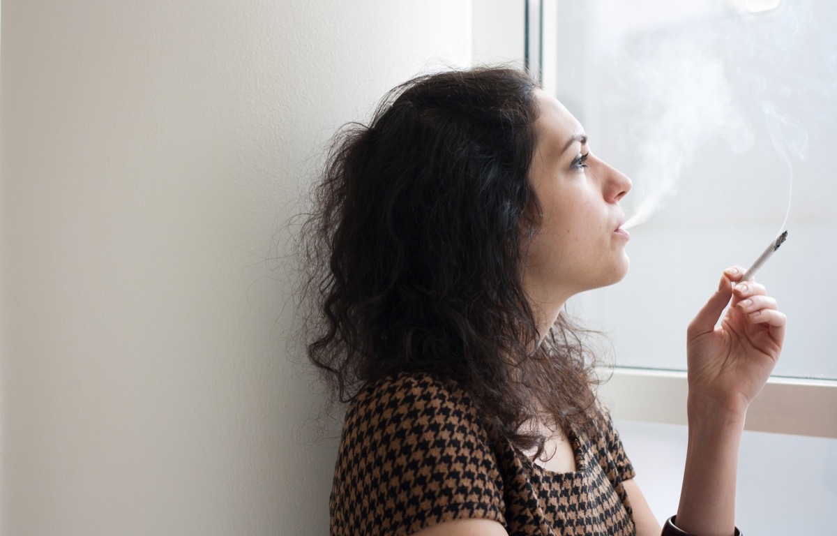 woman smoking indoors