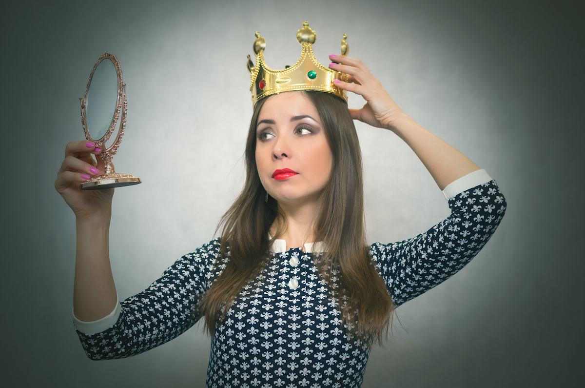 Selfish woman wearing a crown