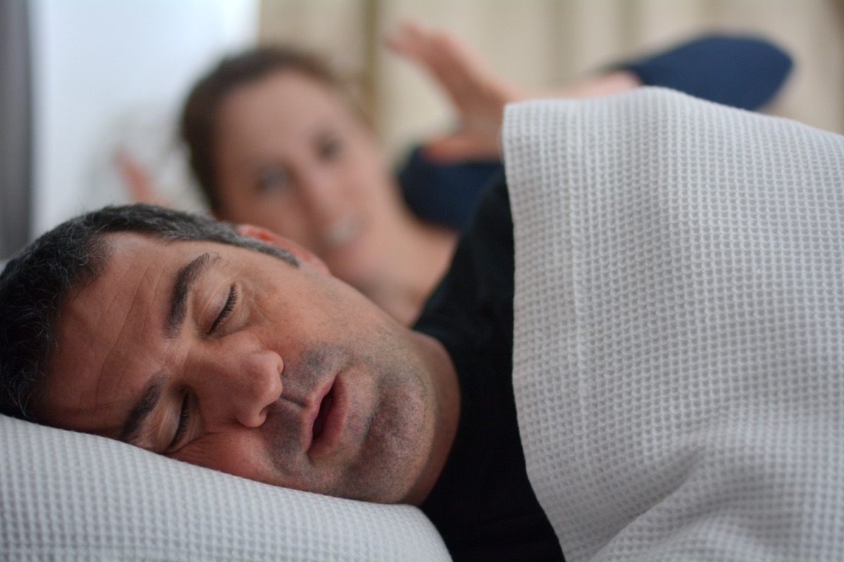 Man Snoring in Bed