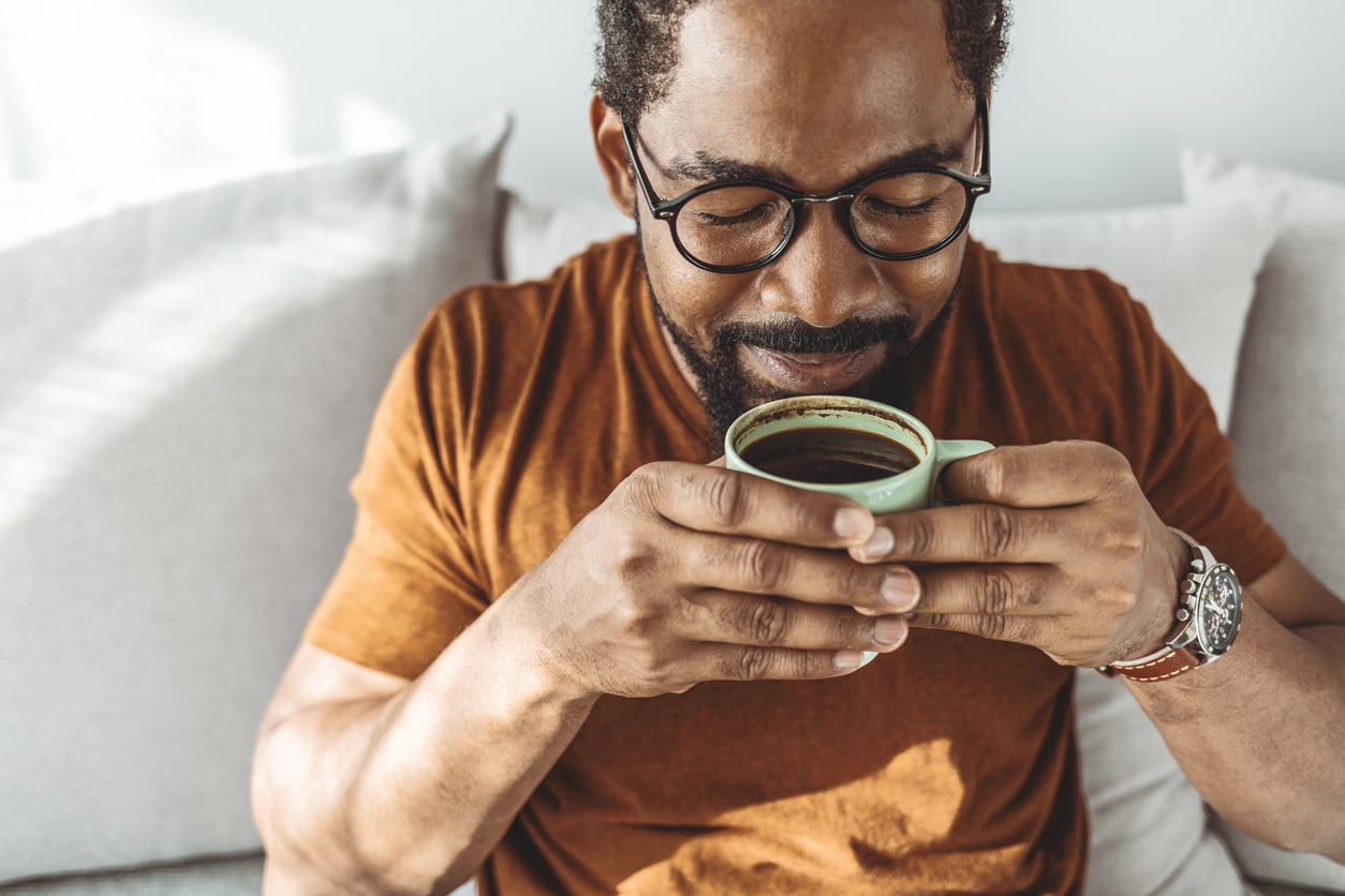 Man drinking coffee.