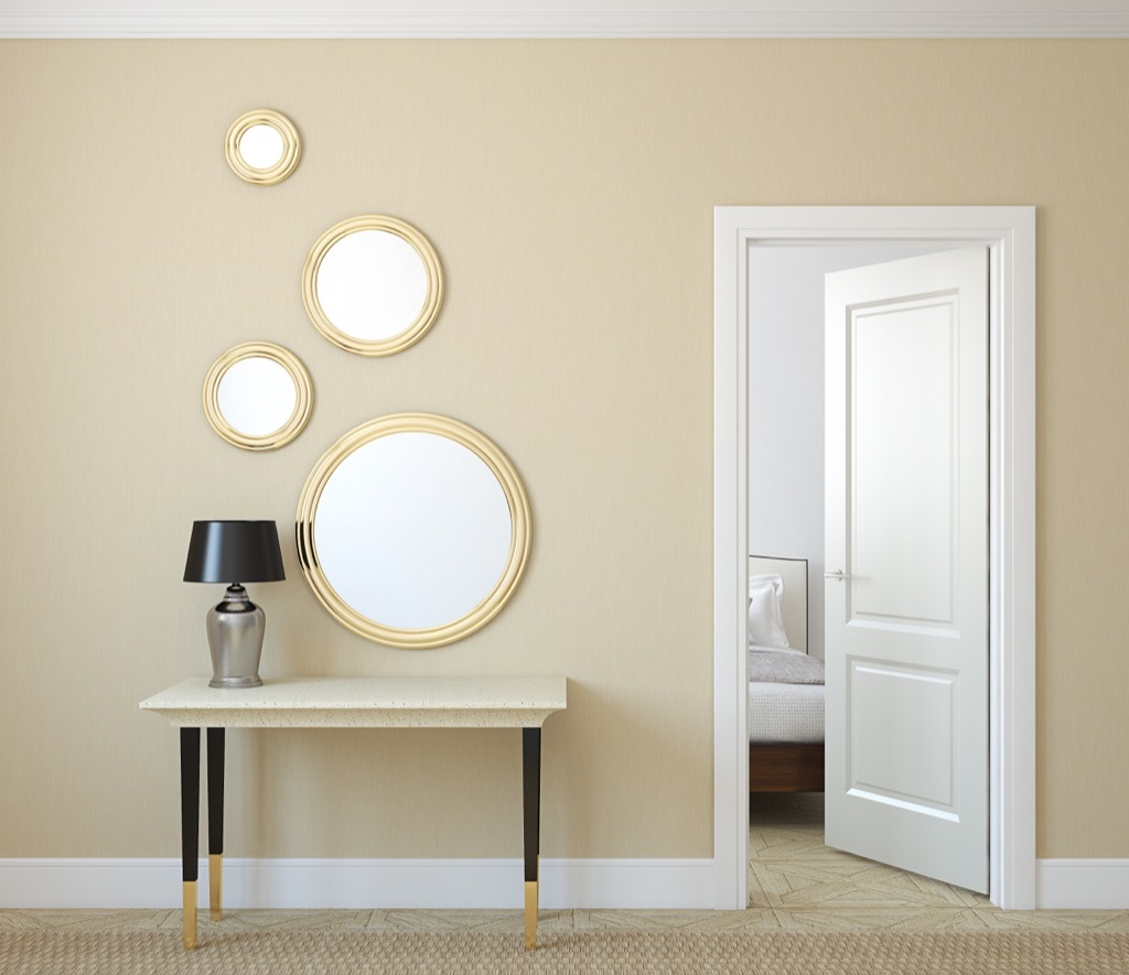 four mirrors hanging in living room