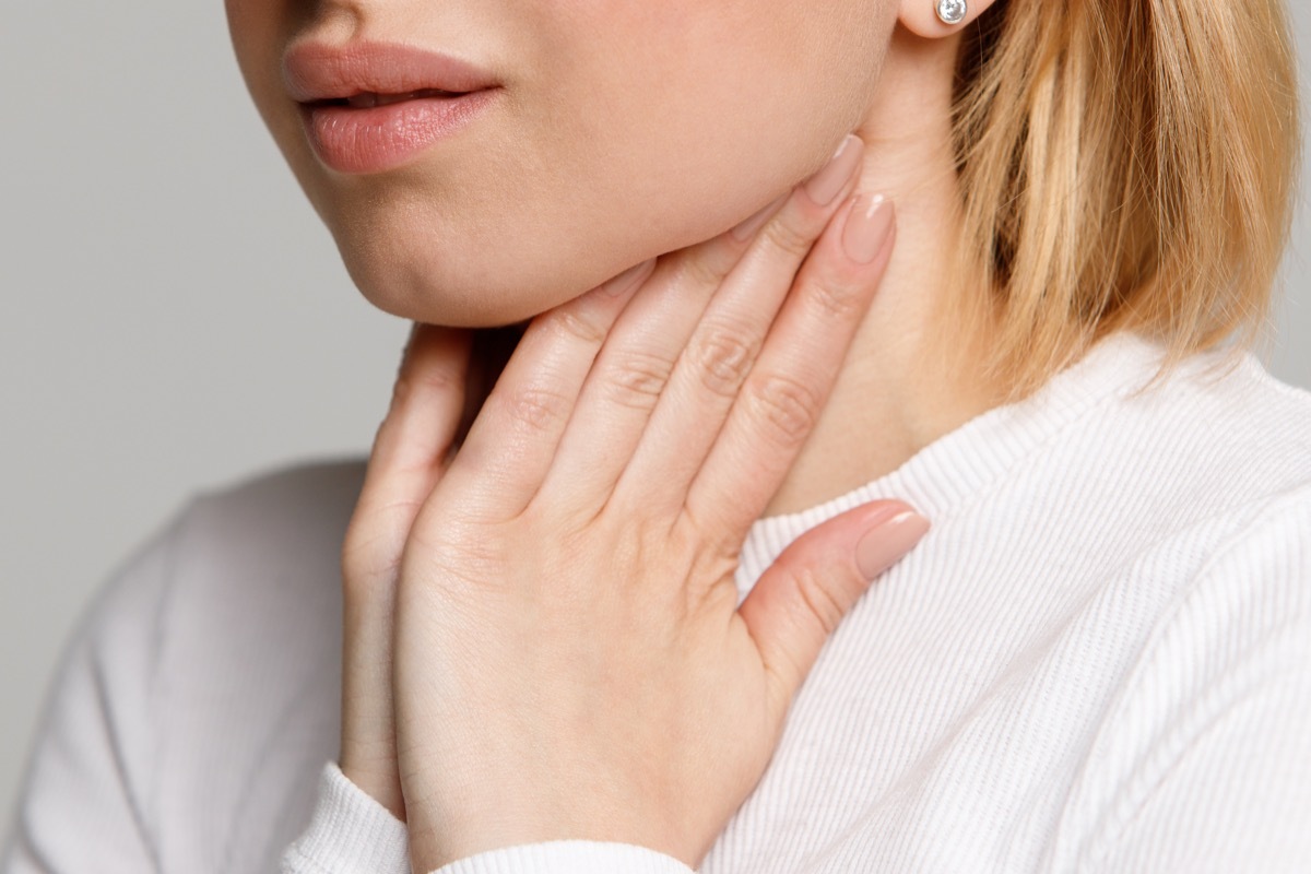 Woman checking out her swollen lymph nodes