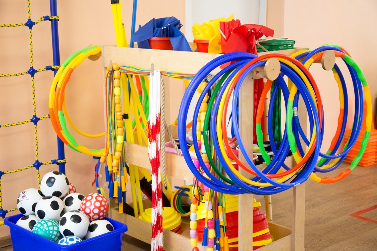 children's sports equipment with hula hoops, scooters, and soccer balls