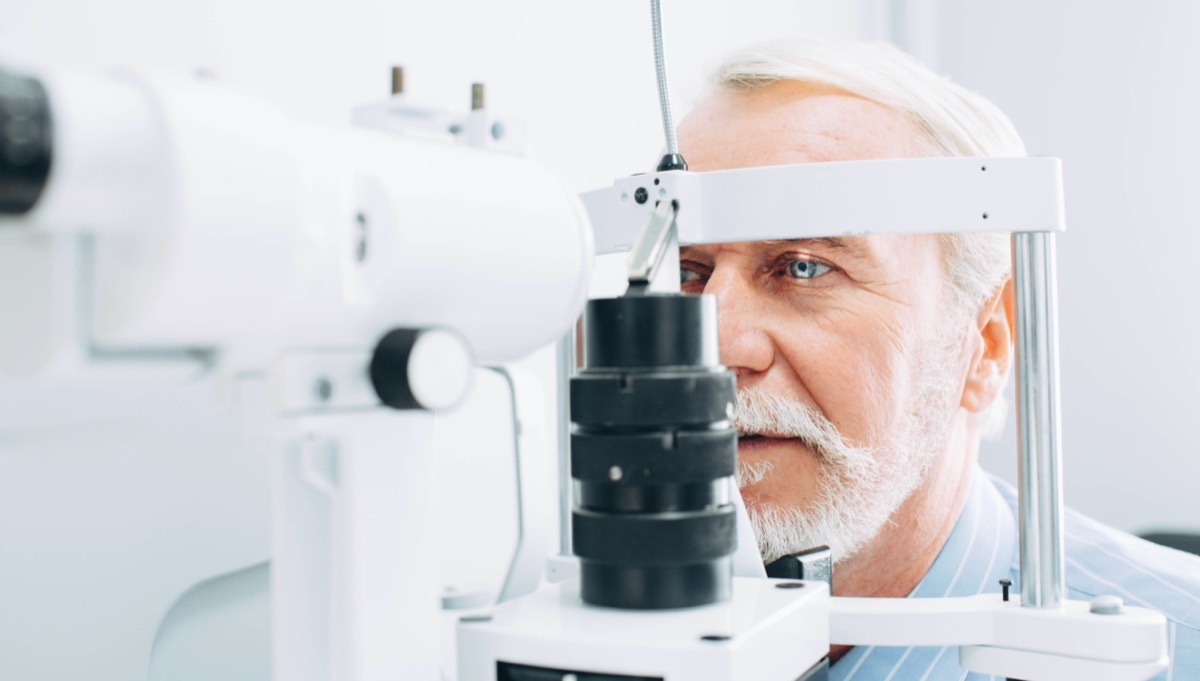 Senior man getting eye exam