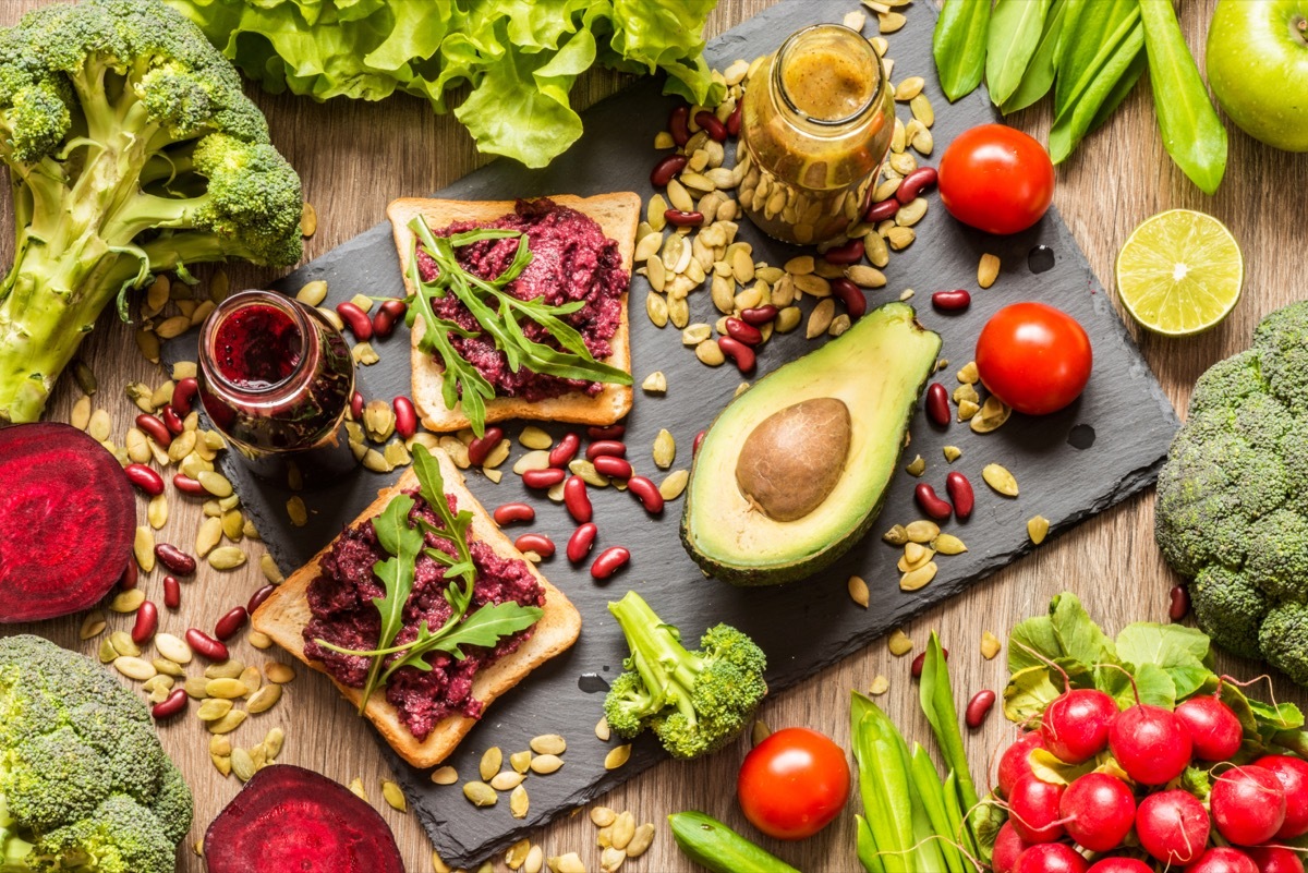 vegan food and ingredients on wooden table