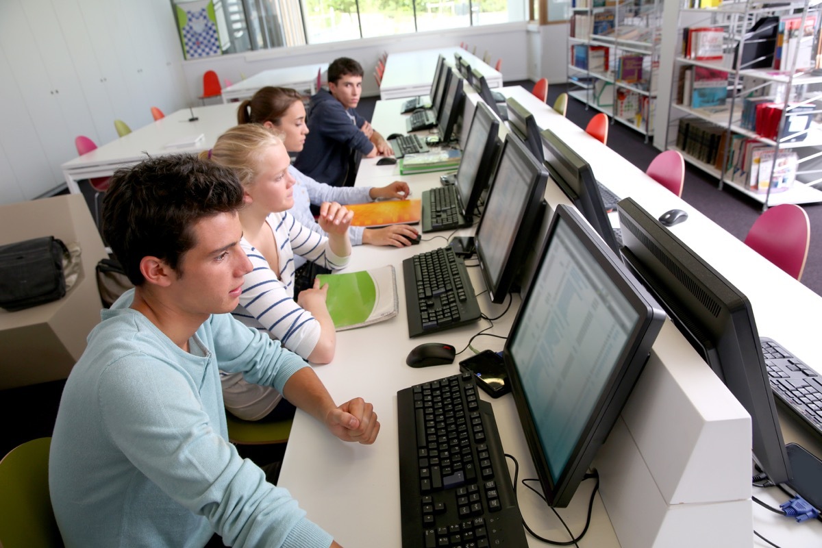 group of students in an early computer lab