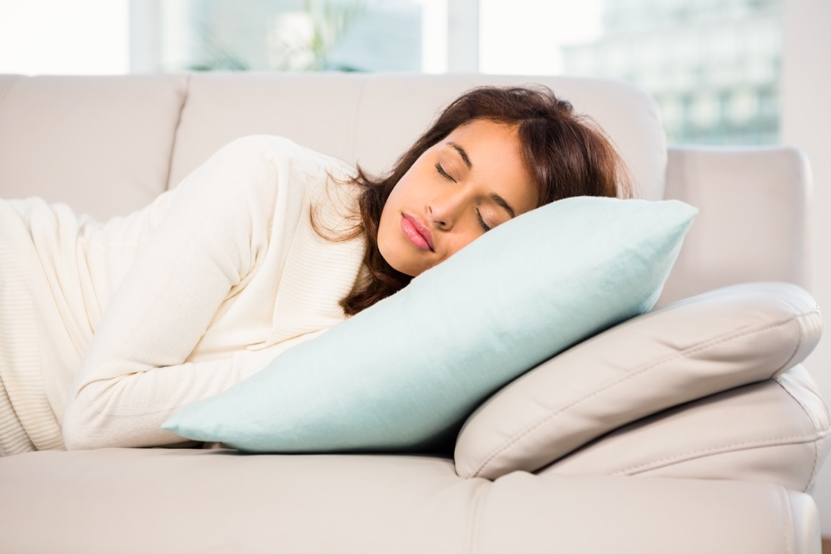 woman napping on couch