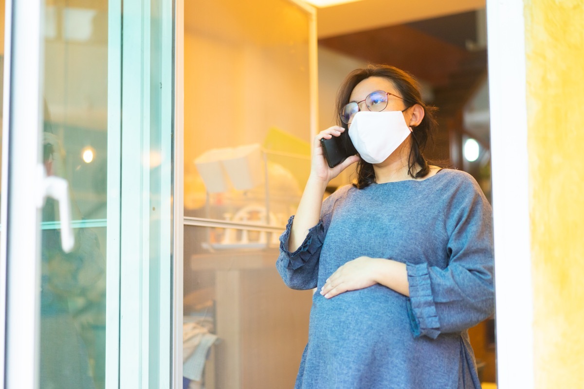 Pregnant woman talking on phone