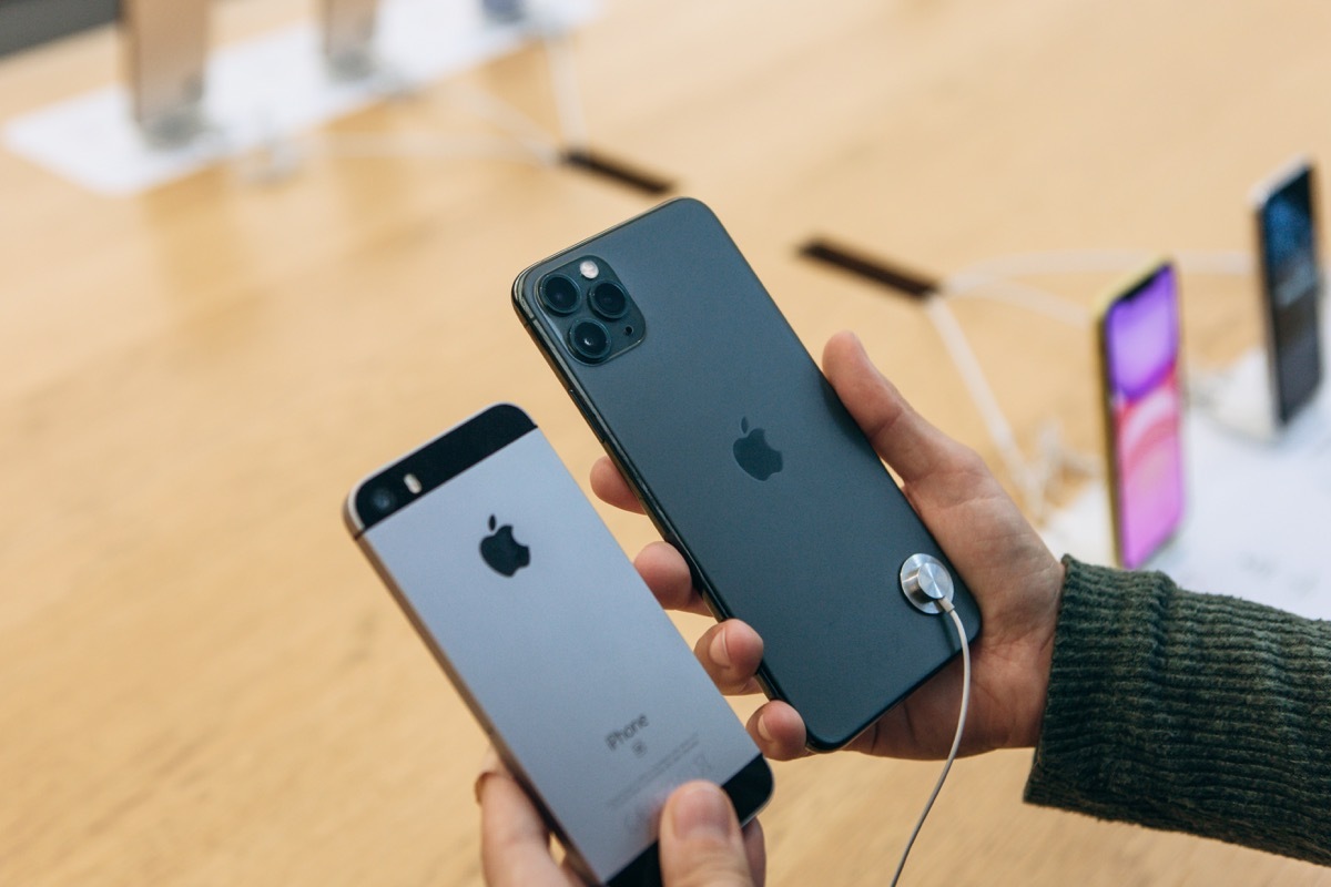 Turkey, Istanbul, December 17, 2019: The buyer compares the camera on the old iPhone and the latest modern iPhone 11 pro max in the Apple store.