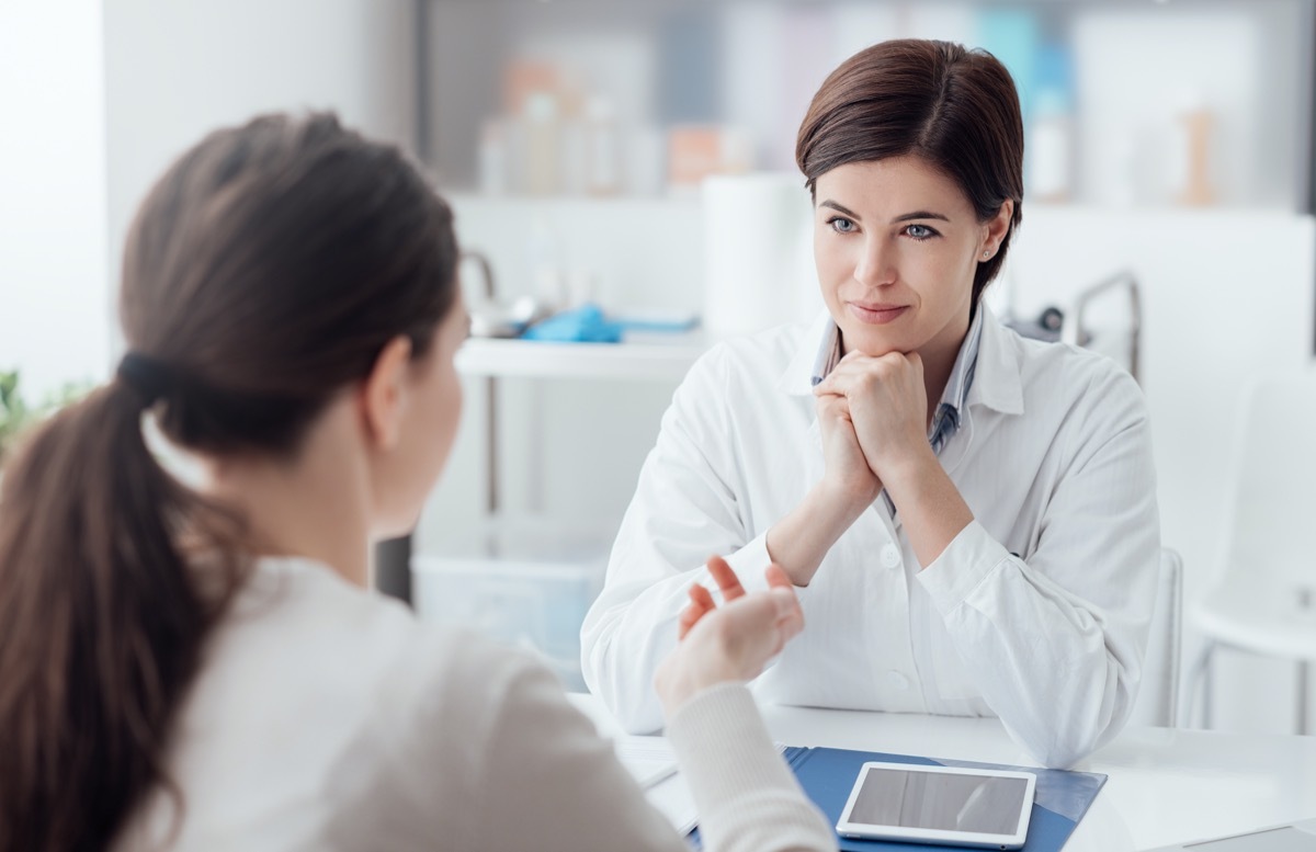 Doctor working in the office and listening to the patient