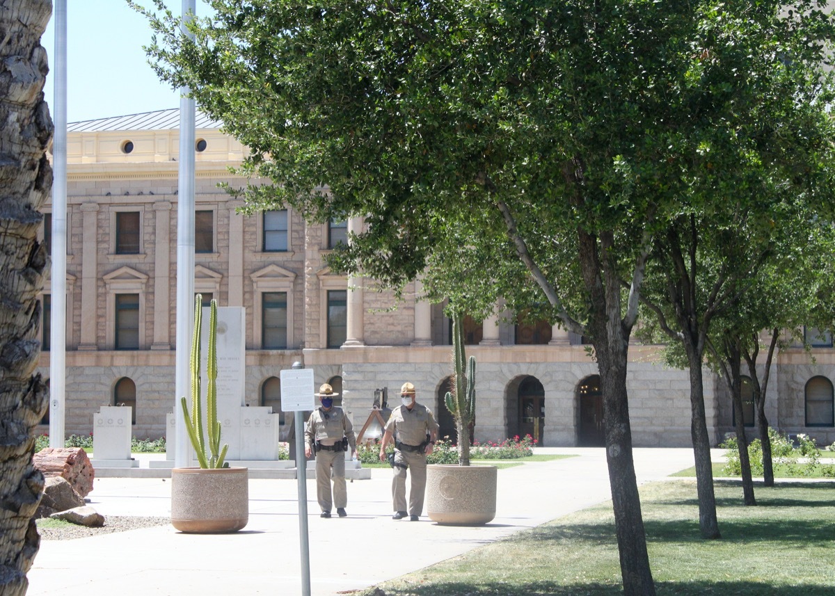 Phoenix, Ariz. / US - May 3, 2020: Wearing masks, State Capitol Police monitor Trump supporters rallying to 