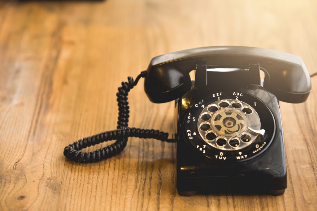 black Telephone on wood table