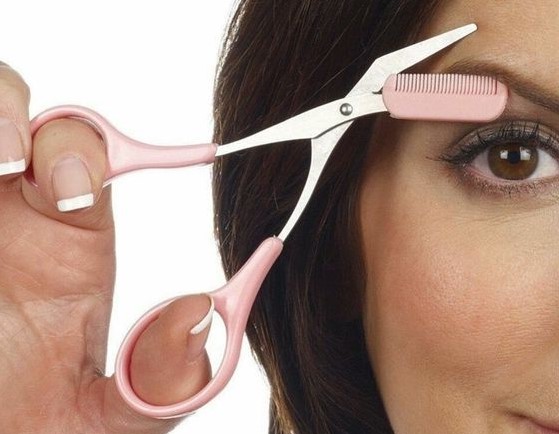 angled eyebrow trimming scissors | How to Trim Your Eyebrows Without Messing Them Up | Her Beauty