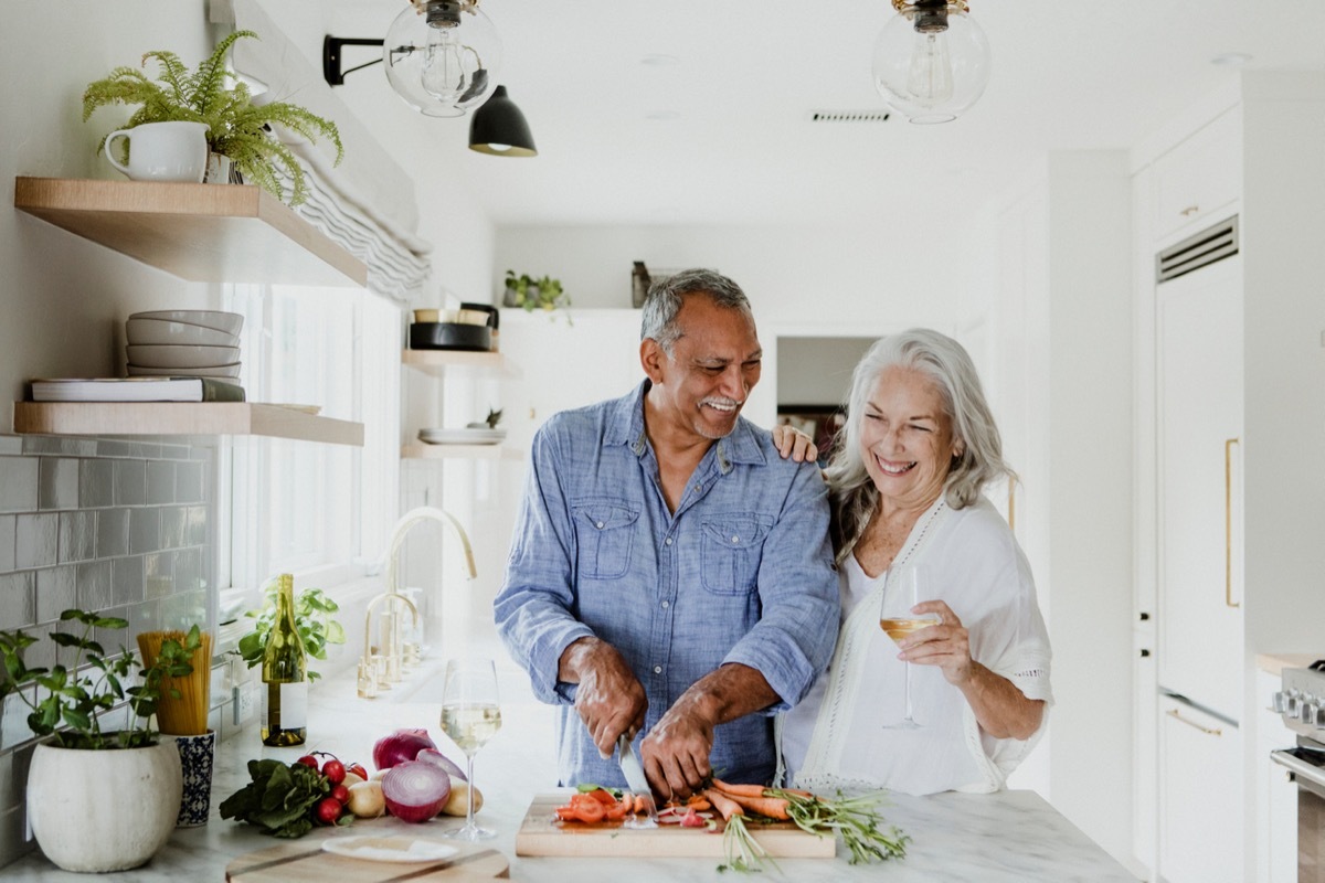 Older couple cooking together