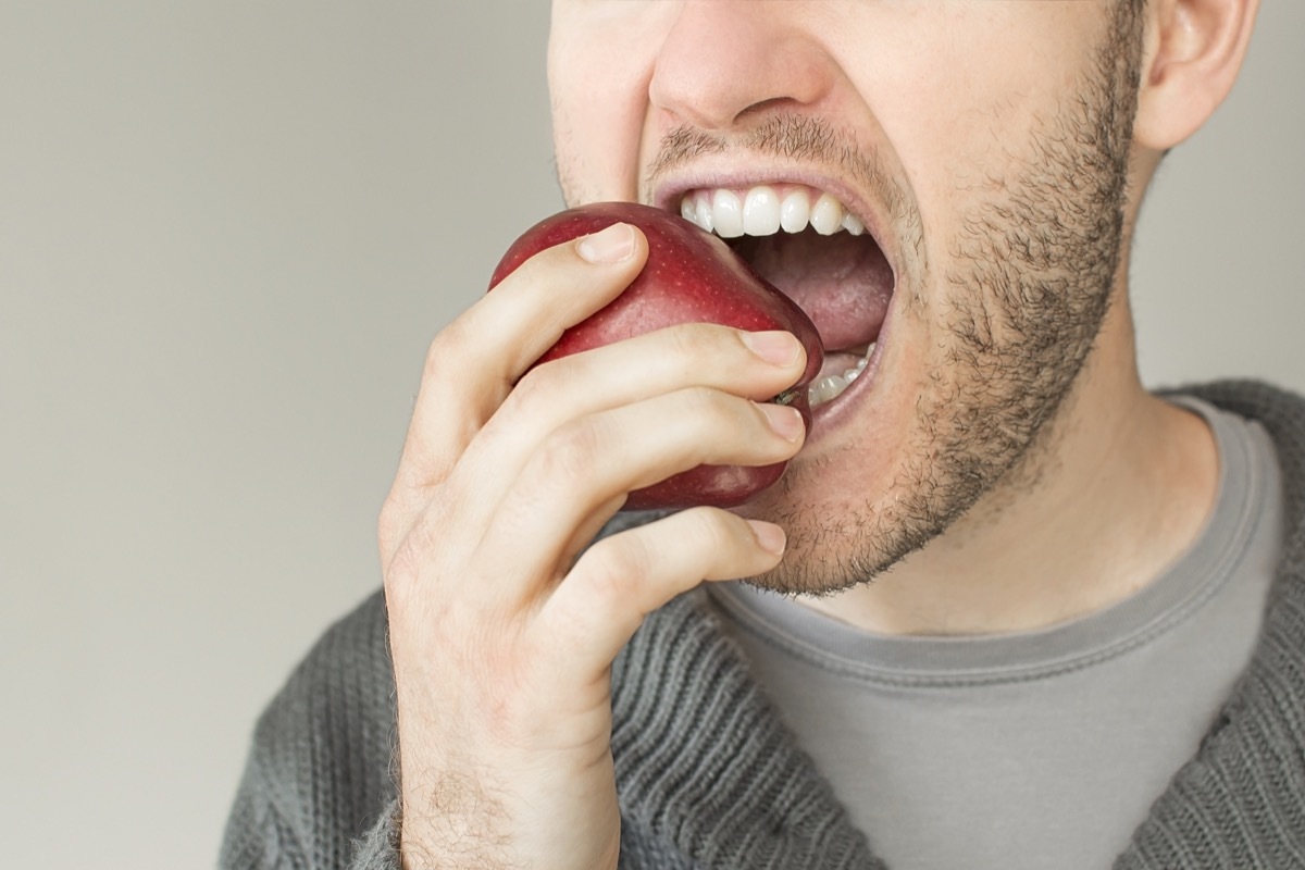 Man eating an apple