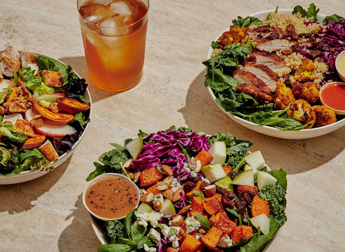 three custom bowls from sweetgreen with iced tea