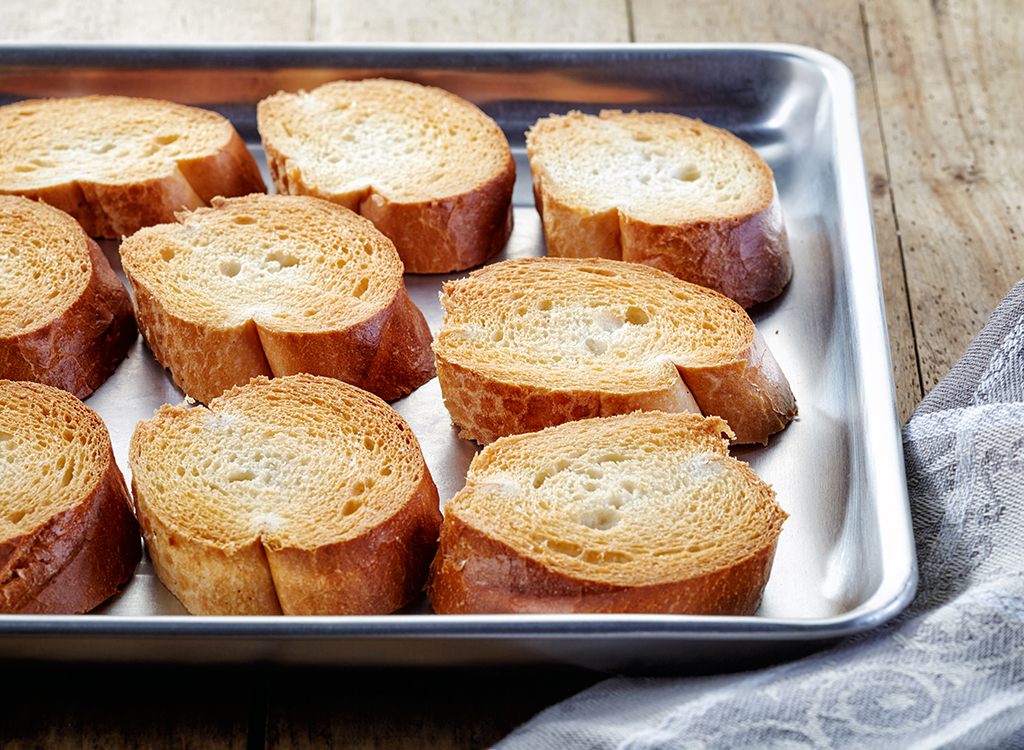 slices of toasted baguette on baking sheet