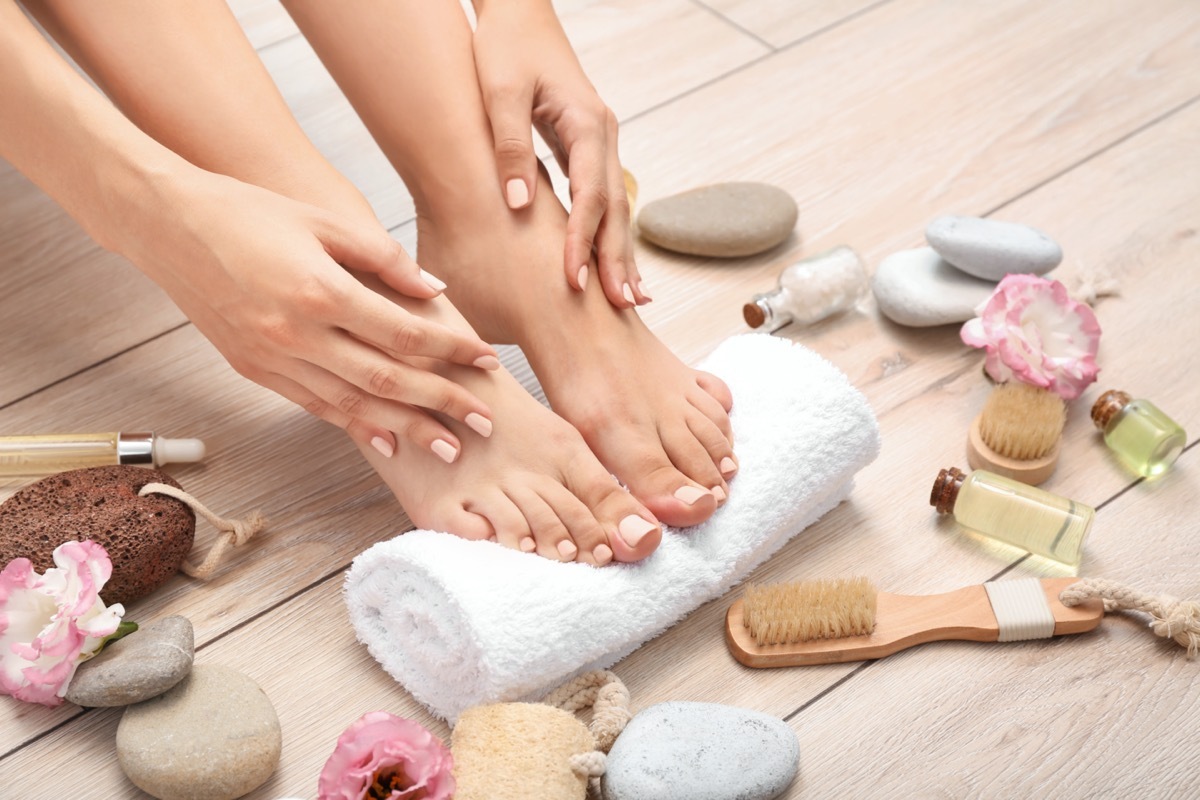 woman after spa pedicure treatment in beauty salon