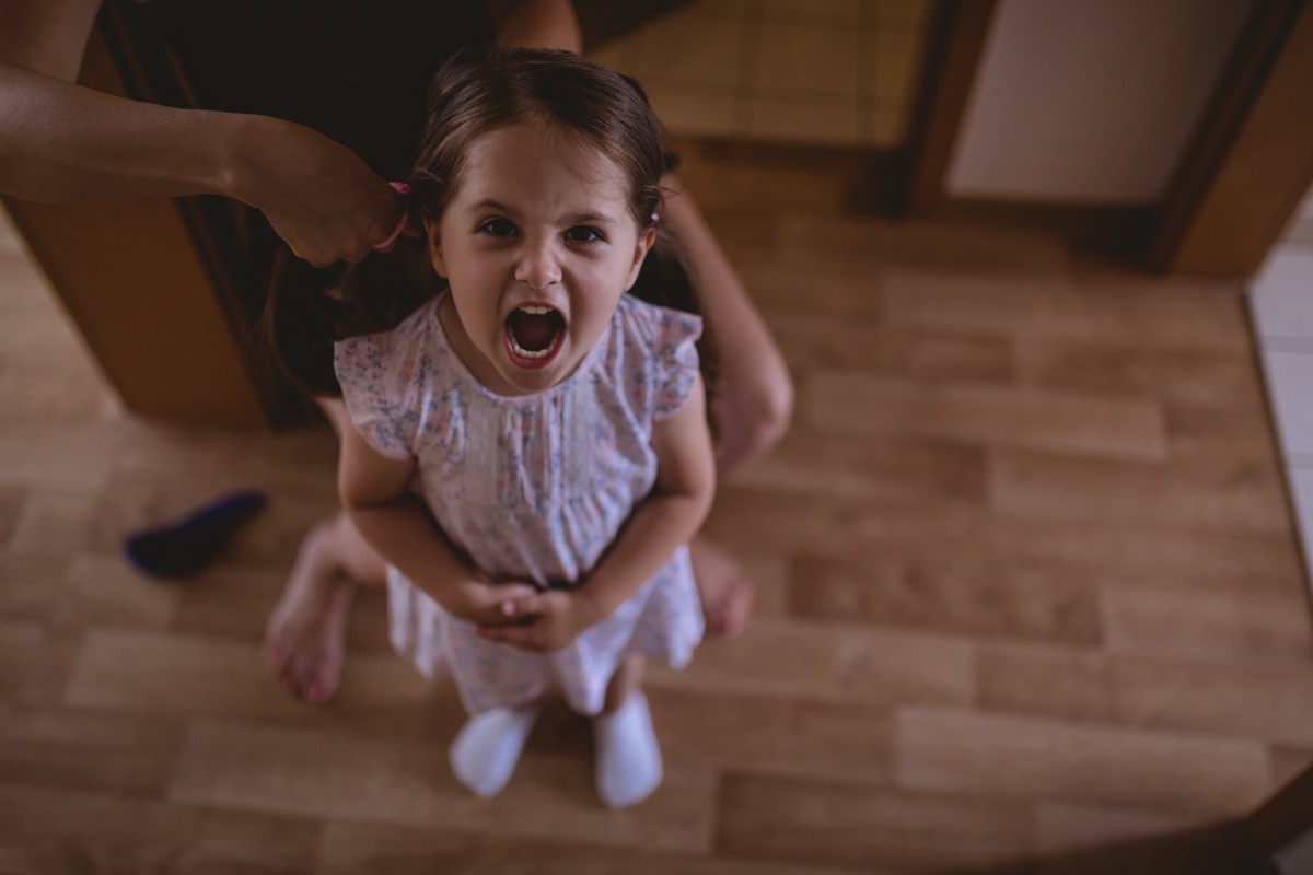 young daughter yelling up at her mother