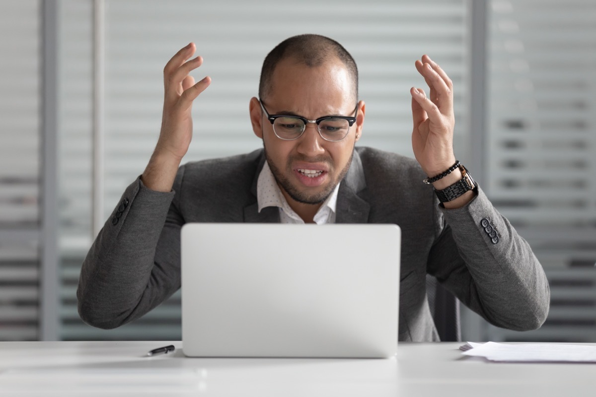 man angry at laptop