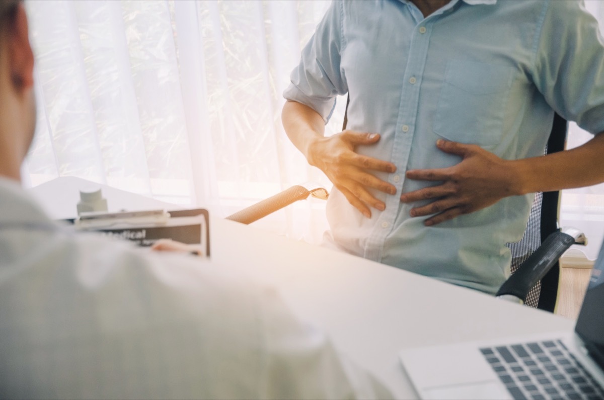 man holding stomach