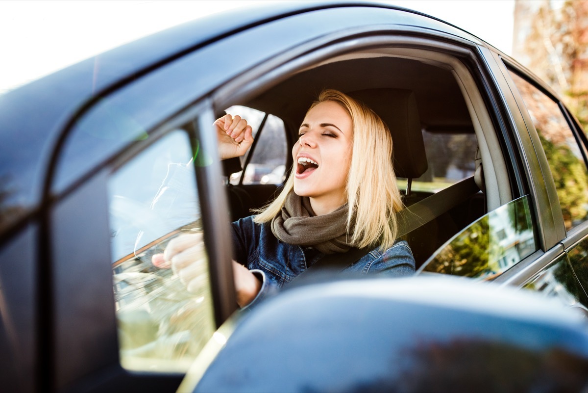 Woman singing in the car