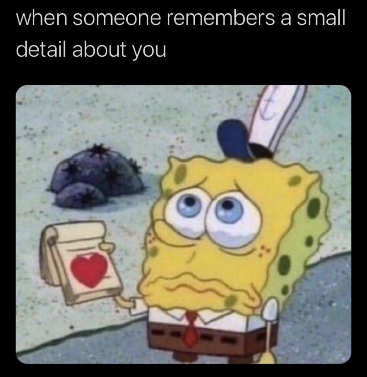 Cartoon of crying SpongeBob holding a notebook with a heart, captioned, 