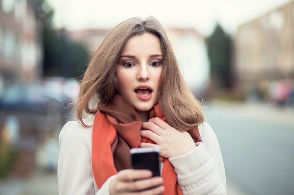 woman reading literotica on a smartphone