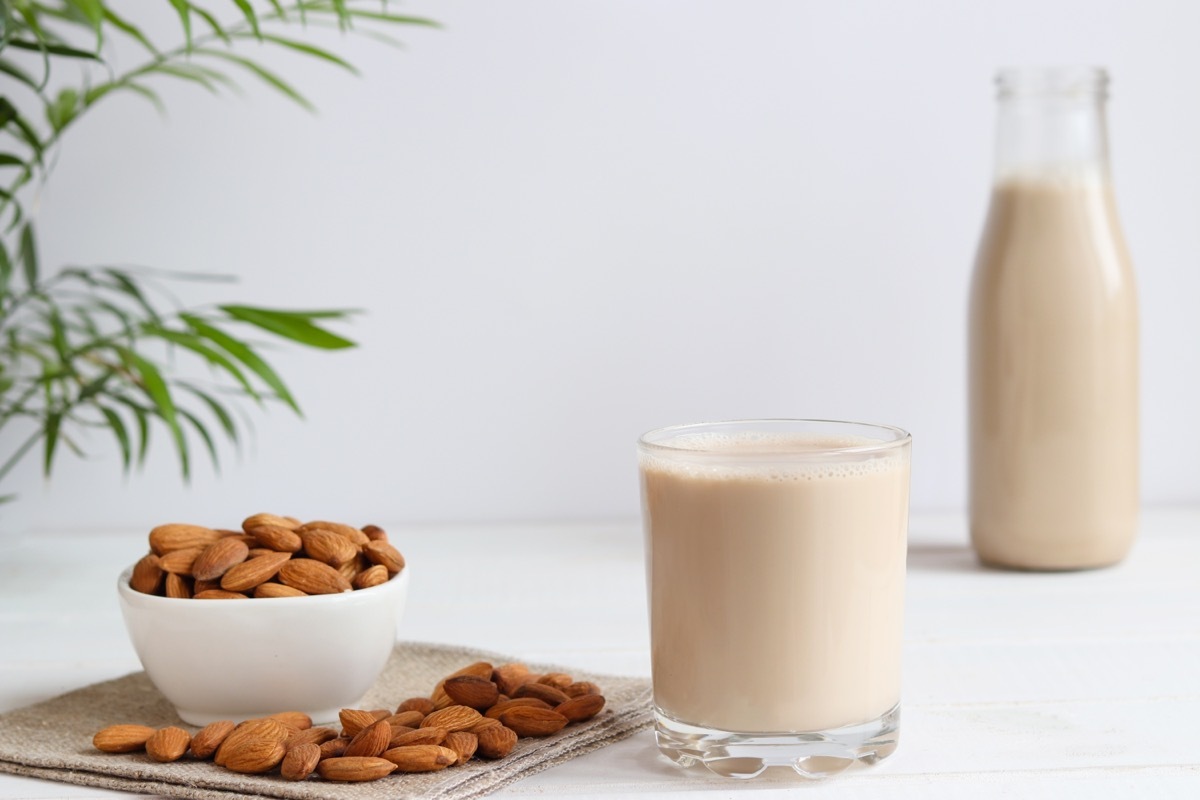 Almond Milk Next to Bowl of Almonds