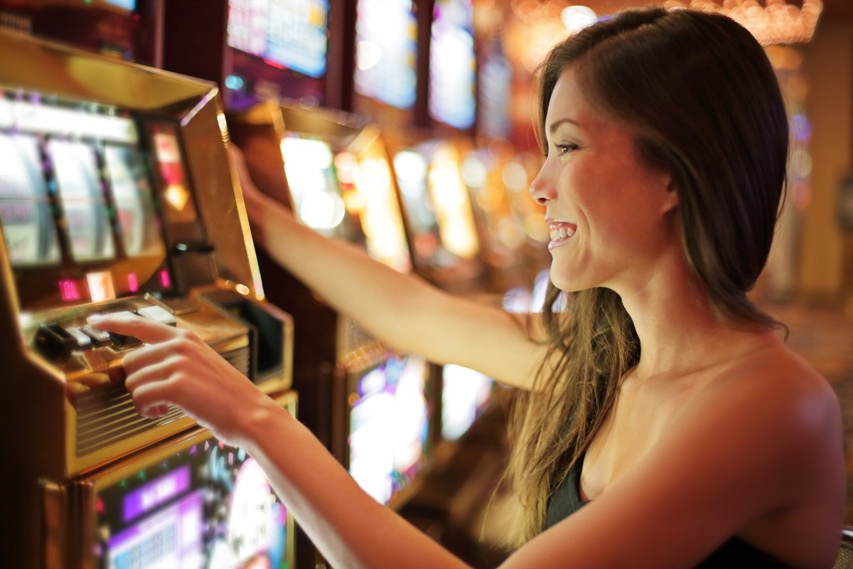 woman playing slot machines game cages worker jobs with high divorce rates