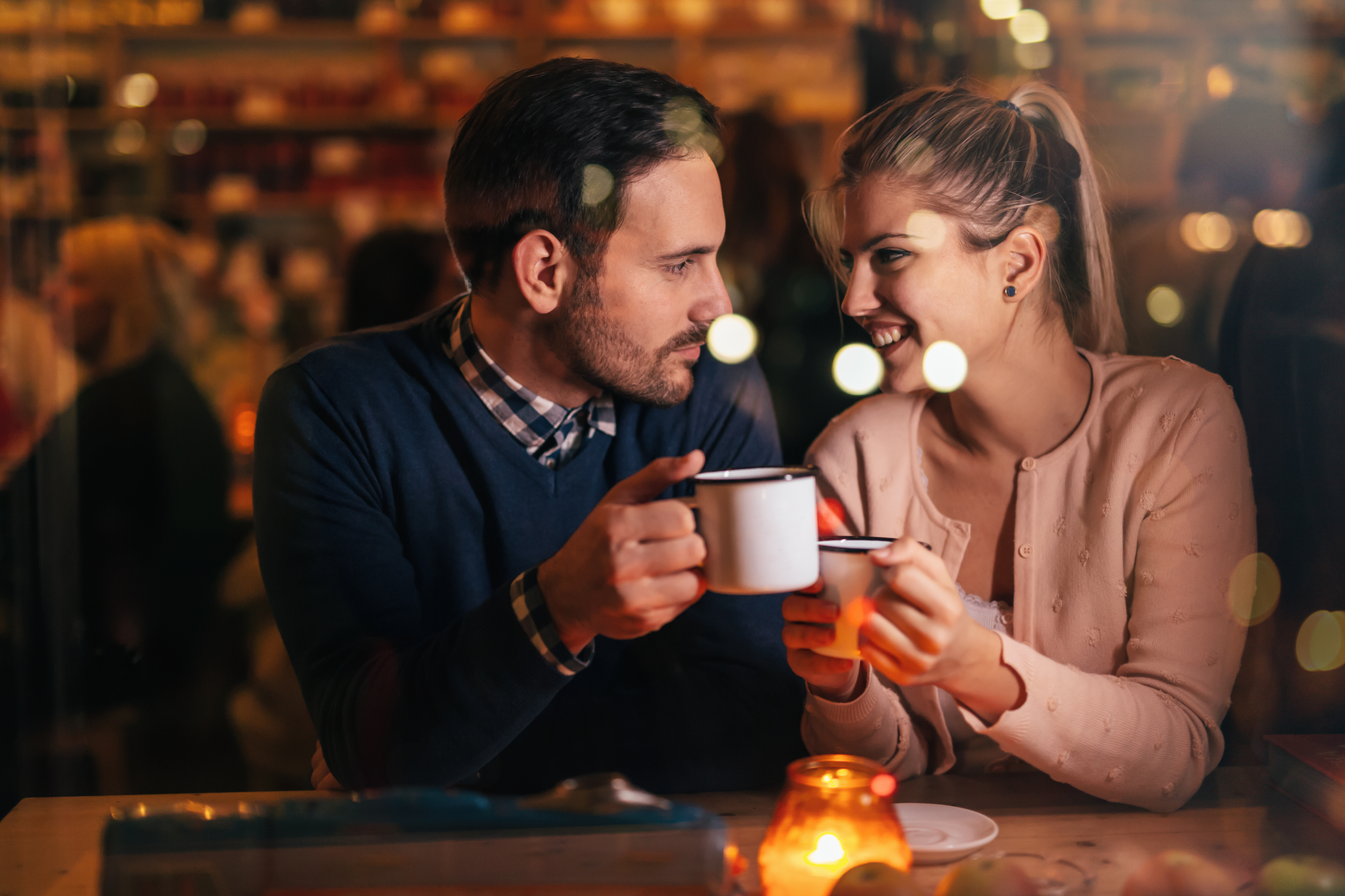 man and woman smiling over coffee, what he wants you to say