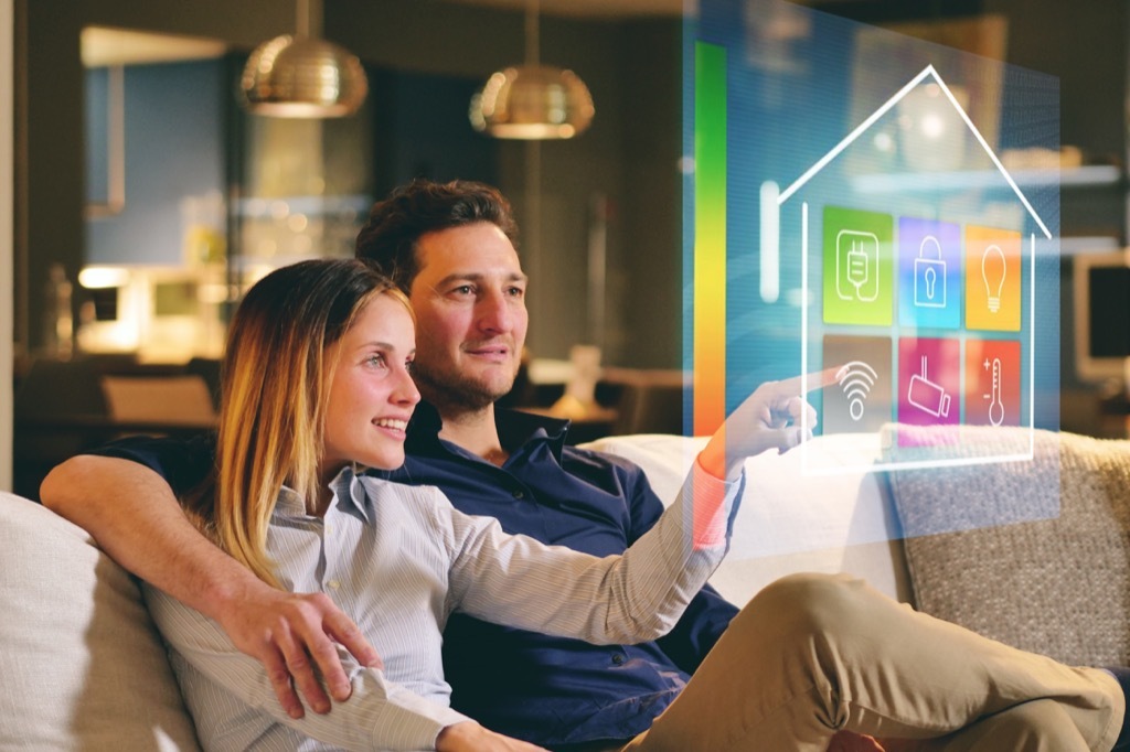 couple sitting on a sofa in a smart home