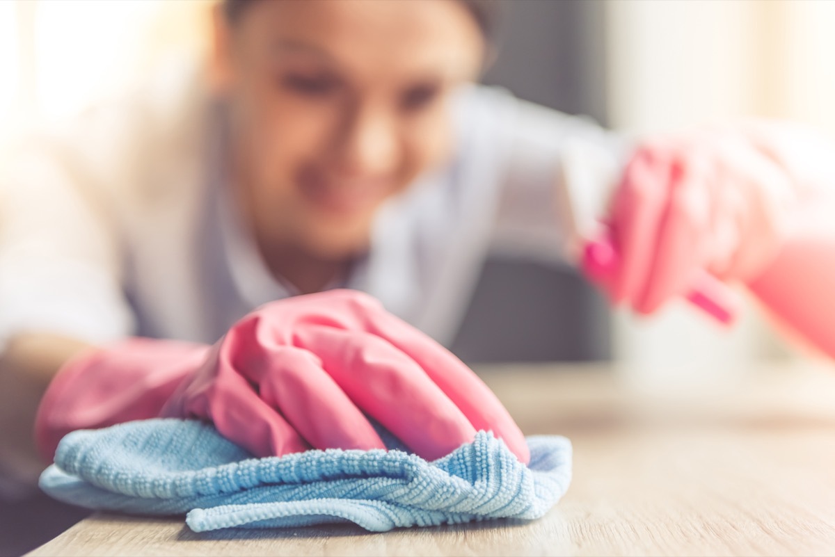 Woman cleaning with microfiber cloth