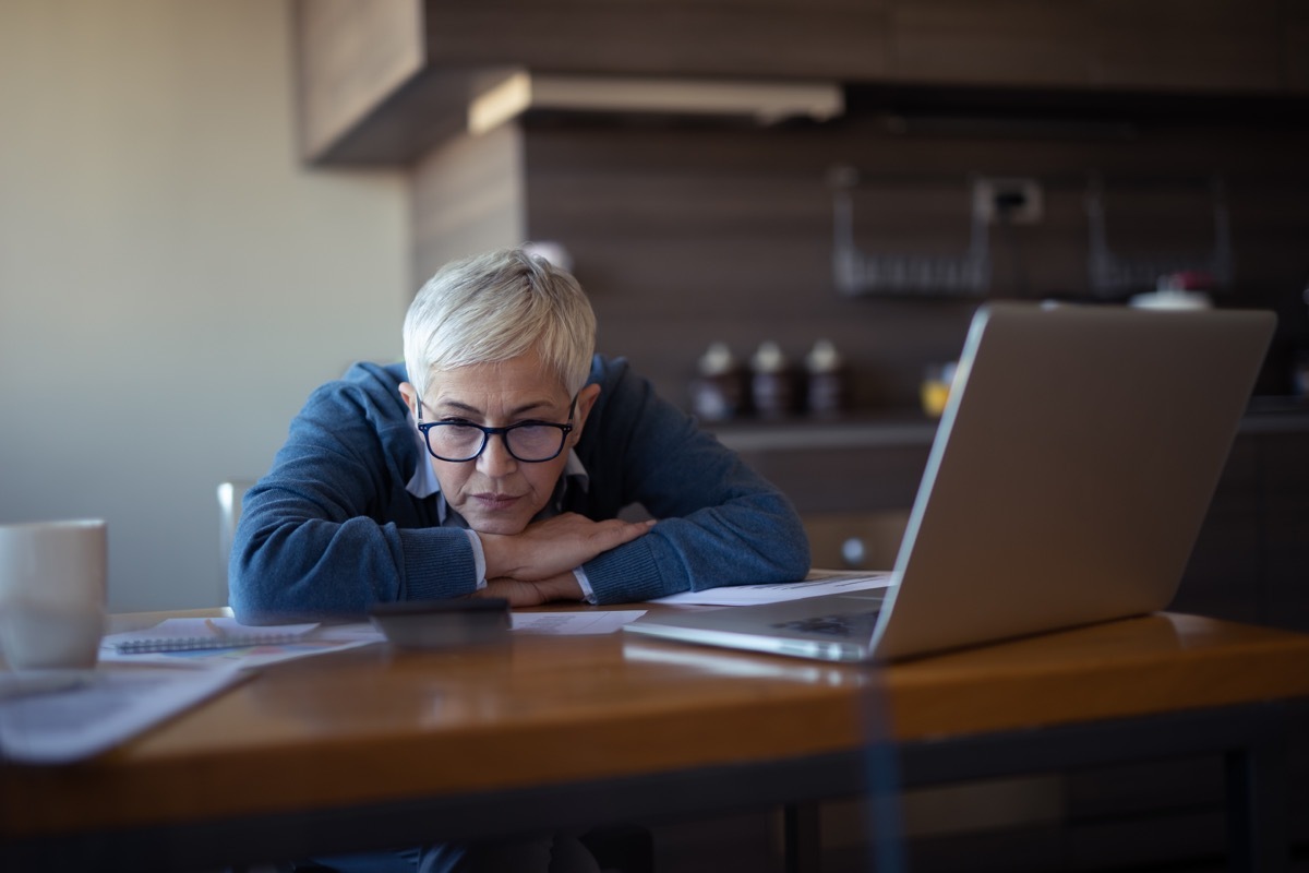 Photo of a senior woman going through financial problems