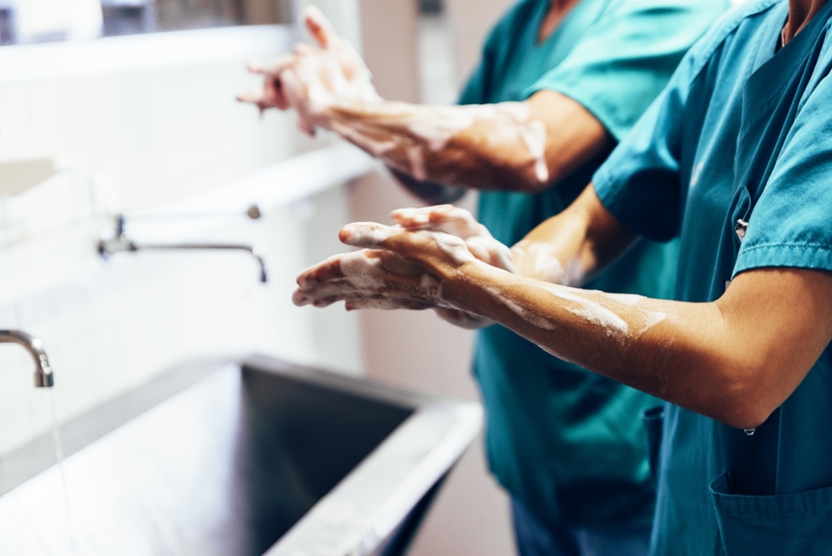 Surgeons nurses washing hands