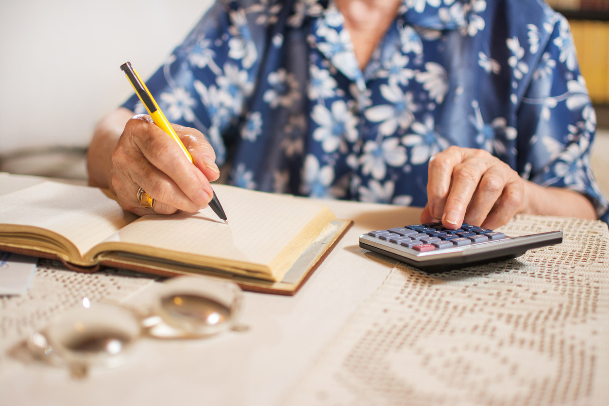 Woman doing finances at home.