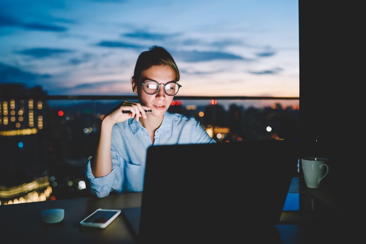 young woman working late at the office