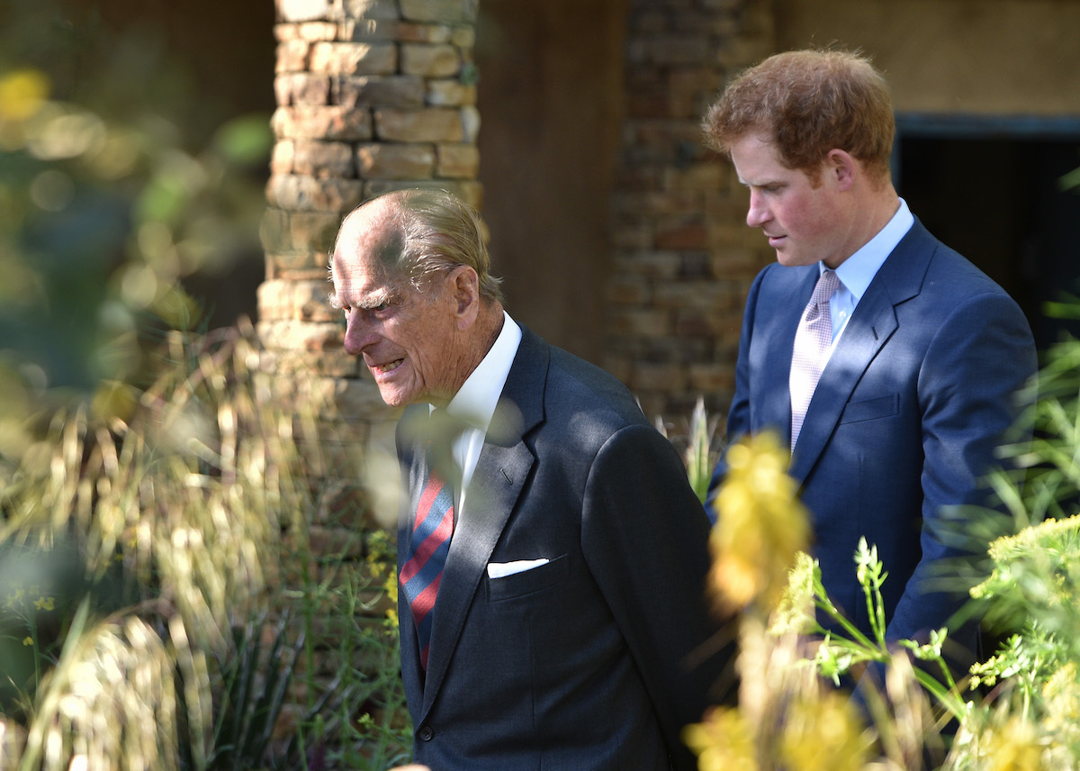 Prince Philip, Duke of Edinburgh and Price Harry attend the annual Chelsea Flower show at Royal Hospital Chelsea on May 18, 2015 in London, England