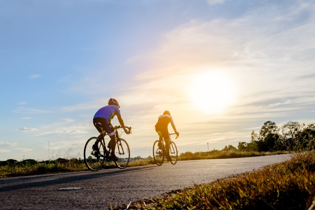 two men riding bikes