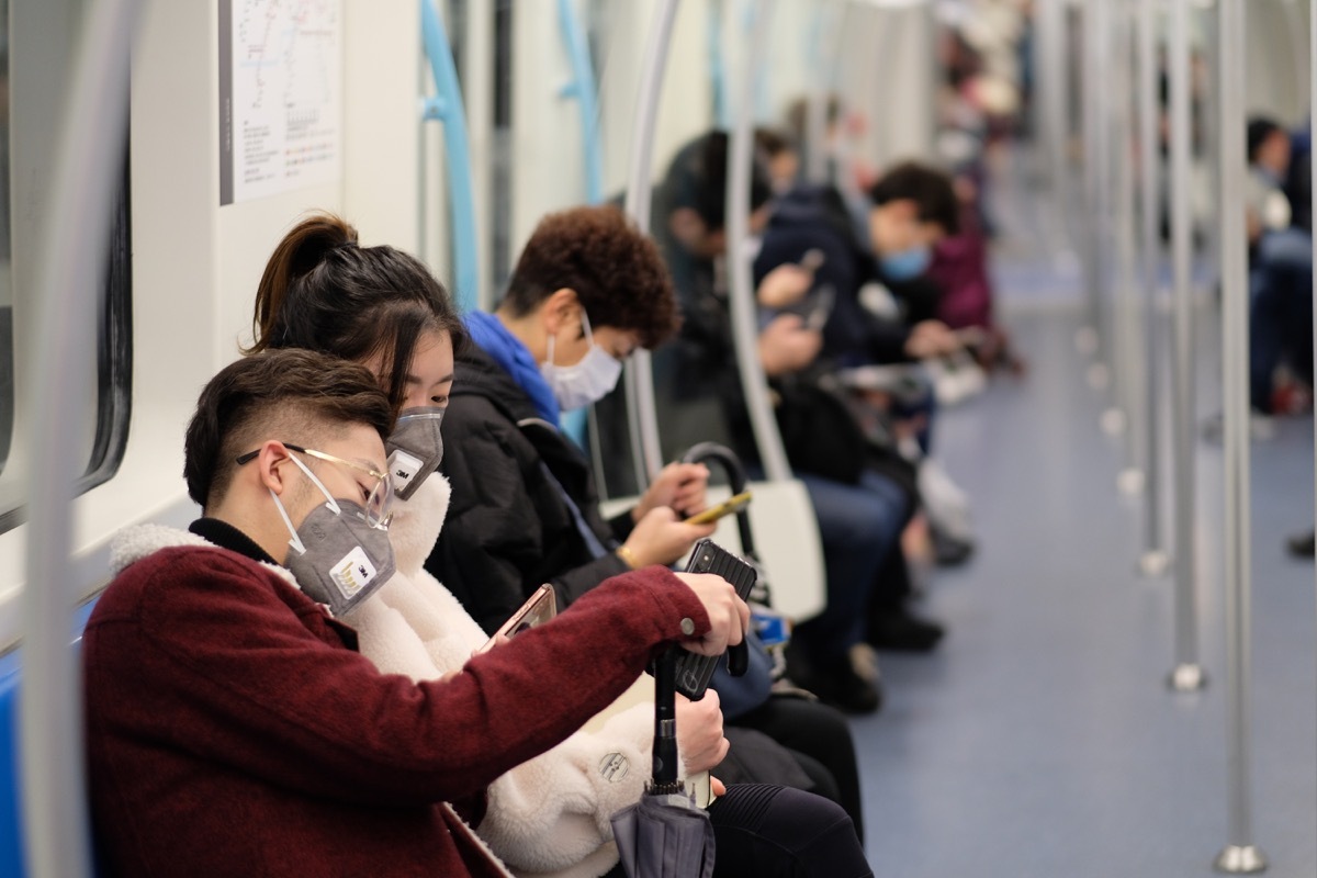 People wearing masks while riding the train during the coronavirus pandemic