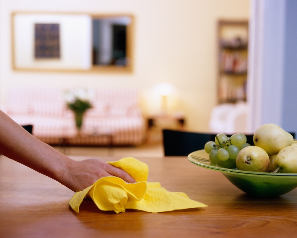 Wiping down dining table