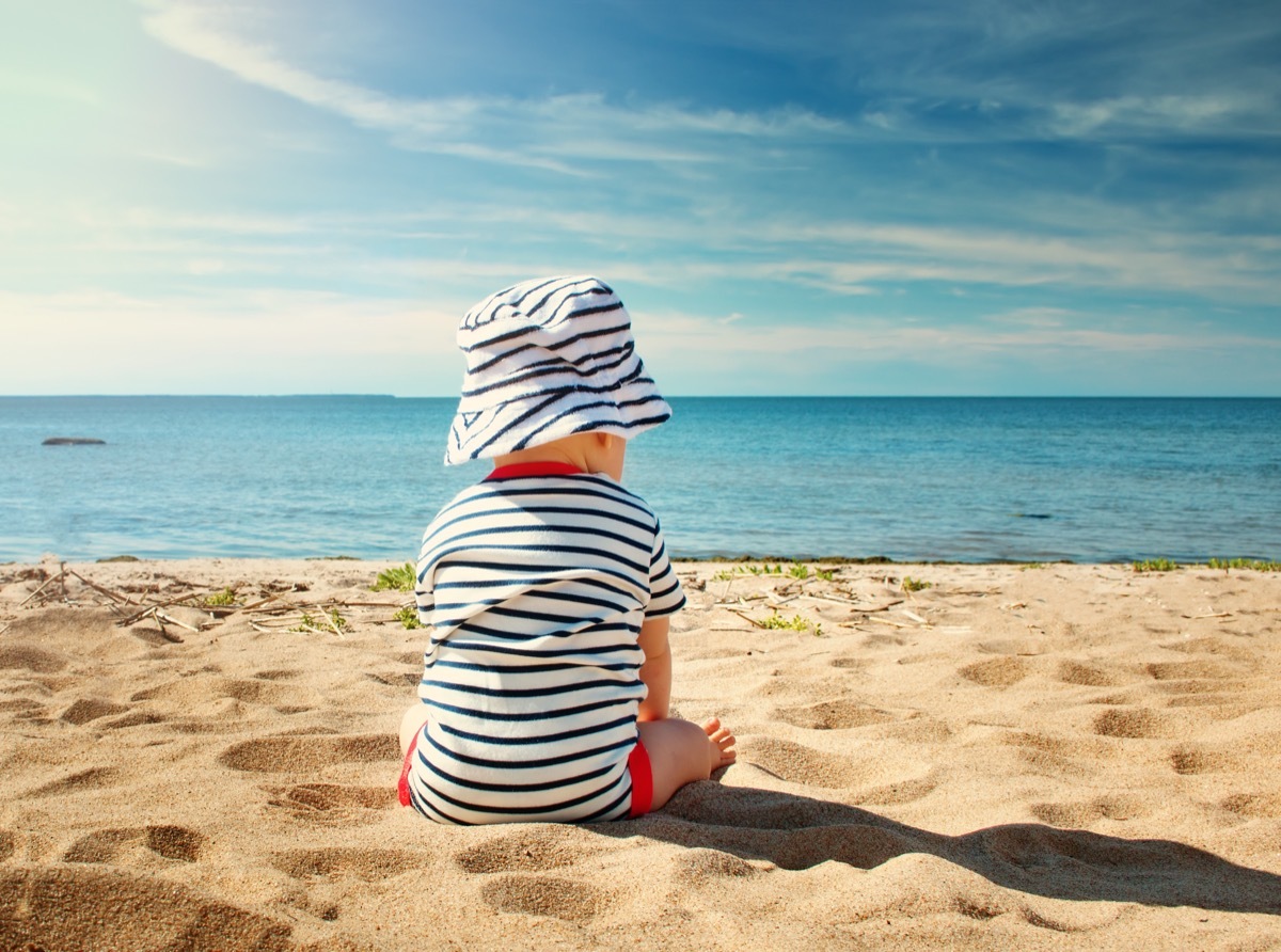 baby sitting on the beach