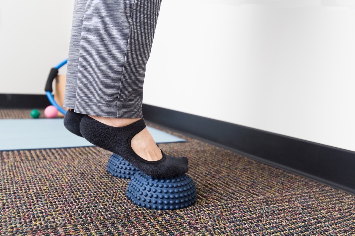 Woman doing foot stretch exercises